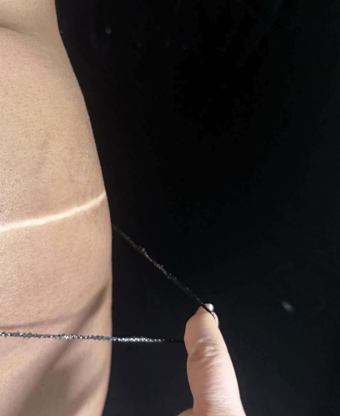 Close-up of a spray tan line and even bronze tone